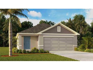Charming single-story home featuring an attached two-car garage, lush landscaping, and a welcoming blue front door at 4375 Sand Dollar Way, Zephyrhills, FL 33541