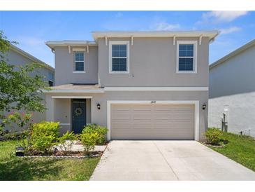 Charming two-story home with a two-car garage and well-maintained landscaping at 2449 Moon Shadow Rd, New Port Richey, FL 34655