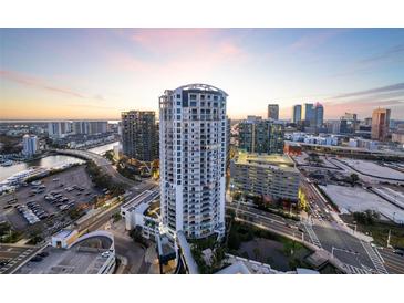 Stunning aerial view of a modern condo building in the city with water views, offering a luxurious urban lifestyle at 449 S 12Th St # 2205, Tampa, FL 33602