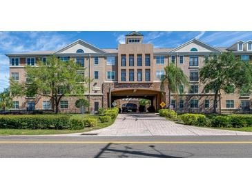 Stunning exterior view of an upscale condominium complex with manicured landscaping and attractive architecture at 4221 W Spruce St # 1303, Tampa, FL 33607