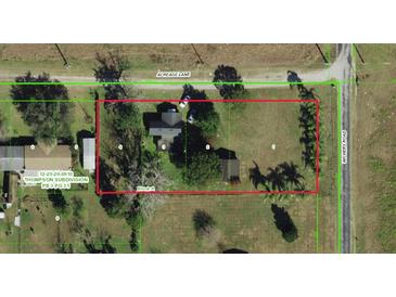 Aerial view of property with mature trees, surrounded by Acreage Lane and Wichers Road at 11951 Wichers Ln, San Antonio, FL 33576