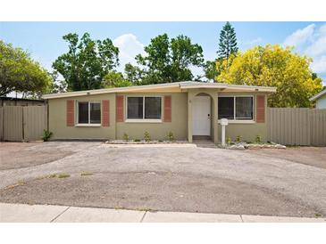 Charming single-story home with a cozy front yard and a well-maintained exterior paint at 1858 Oregon Ave Ne, St Petersburg, FL 33703