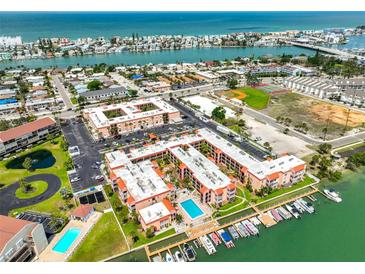 Gorgeous waterfront community with a pool, boat slips, parking, and views of the bay and ocean at 8931 Blind Pass Rd # 262, St Pete Beach, FL 33706