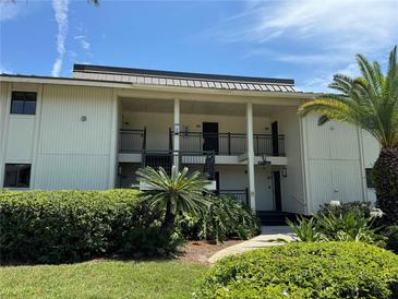 Condominium exterior featuring well maintained landscaping and multi-story balconies at 29129 Bay Hollow Dr # 3201, Wesley Chapel, FL 33543