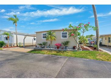 Charming single-story home with covered parking and well-manicured landscaping at 18675 Us Highway 19 N # 261, Clearwater, FL 33764