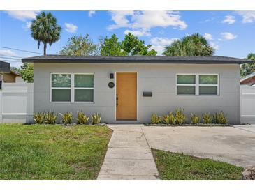 Charming home with a modern front door, well-maintained lawn, and lush landscaping at 3151 6Th S Ave, St Petersburg, FL 33712