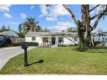 Charming single-story home features a well-manicured lawn and beautiful curb appeal at 4103 W Bay Villa Ave, Tampa, FL 33611