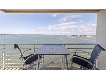 Balcony seating area with beautiful water views and chairs for relaxing and enjoying the scenery at 6105 Bahia Del Mar Cir # 683, St Petersburg, FL 33715