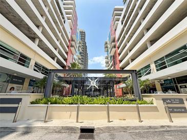 Grand Central at Kennedy entrance showcases a modern building with lush landscaping at 1208 E Kennedy Blvd # 831, Tampa, FL 33602