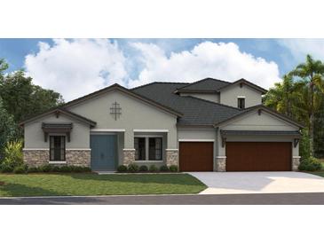 Charming home featuring a blue front door, stone accents and a two-car garage at 12828 Daleridge Pl, Riverview, FL 33579