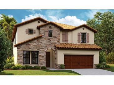 Charming two-story home with a stone facade, tile roof, a two-car garage and manicured lawn at 8513 Dove Bog Ter, Parrish, FL 34219