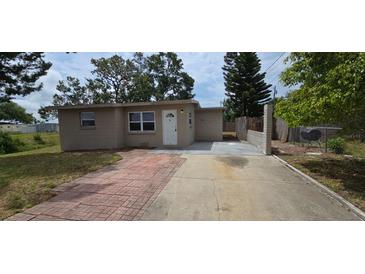 Charming single-story home featuring a well-maintained front yard and inviting entryway at 10118 114Th Ter, Largo, FL 33773