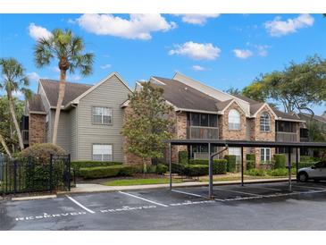 Charming multi-Gathering condo with tropical landscaping, screened in porches and covered parking at 2500 Winding Creek Blvd # A104, Clearwater, FL 33761