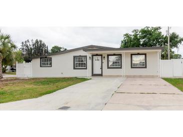 Charming single-story home featuring a well-maintained lawn and inviting covered entry at 4902 Murray Hill Drive, Tampa, FL 33615