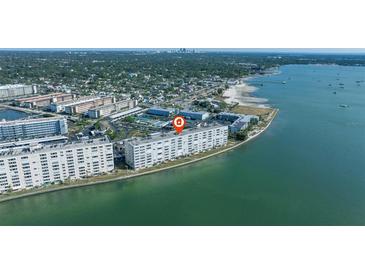 A stunning aerial view showcases the waterfront condo with amazing views of the bay and the Gulf at 5900 Shore S Blvd # 512, Gulfport, FL 33707