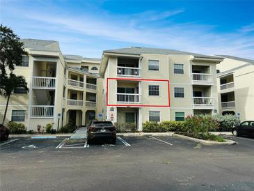 Inviting condo building with accessible parking and well-maintained landscaping, featuring a private balcony for outdoor enjoyment at 6931 Stones Throw N Cir # 5210, St Petersburg, FL 33710