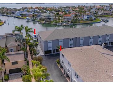 Beautiful waterfront condo with boat slip access, surrounded by lush landscaping and stunning water views at 521 Pinellas Bayway S # 301, St Petersburg, FL 33715