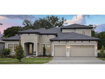 Stunning two-story home featuring a neutral palette, well-manicured landscaping, a gray roof, and a two-car garage at 4630 Cedar Fog Ct Dr, Valrico, FL 33596
