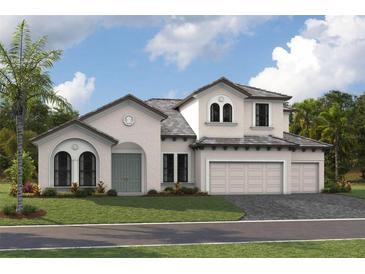Stunning two-story home with a three-car garage, beautifully landscaped yard, and charming architectural details at 166 Hidden Estates Ct, Brandon, FL 33511