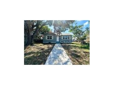 Charming single-story home featuring a well-kept front yard and inviting walkway at 4214 Fairfield S Ave, St Petersburg, FL 33711