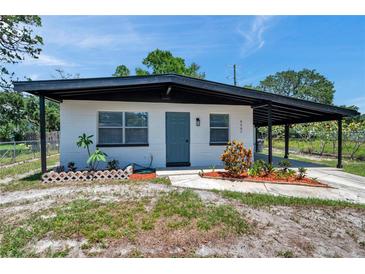Charming single-story home featuring a covered carport and a beautifully maintained front yard at 6507 La Mesa Cir, Tampa, FL 33634