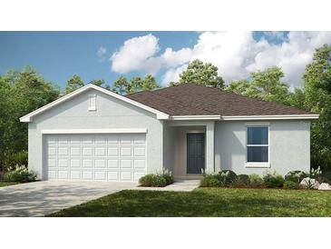 Charming single-Gathering home featuring a two-car garage, low-maintenance landscaping, and a welcoming entrance at 13570 Tropical Breeze Way, Hudson, FL 34669