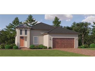 Charming single-Gathering home featuring a two-car garage, a modern design, and a well-manicured lawn at 31748 Griffin Sands Ln, San Antonio, FL 33576