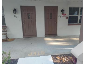 Inviting condo entrances featuring private door with a step; each unit is well-lit with exterior lighting at 650 Pinellas Point S Dr # 101, St Petersburg, FL 33705