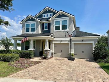 Charming two-story home featuring a large brick driveway, well-manicured lawn and two car garage at 12327 Eagle Swoop Pl, Riverview, FL 33579