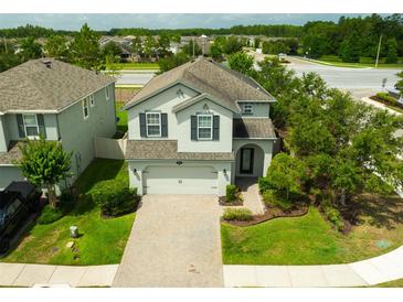 Beautiful two-story home with a brick paver driveway and well-maintained landscaping at 19200 Roseate Dr, Lutz, FL 33558