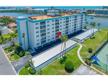 Enjoy waterfront views from this desirable condo building complete with covered parking and lush landscaping at 10216 Regal Dr # 208, Largo, FL 33774