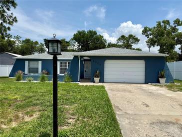 Charming single-story home with a well-maintained lawn and a classic blue exterior at 2270 Amherst Ave, Spring Hill, FL 34609