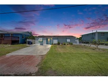 Charming single-story home featuring a well-maintained lawn, classic design, and inviting curb appeal at 825 Seabreeze Dr, Ruskin, FL 33570