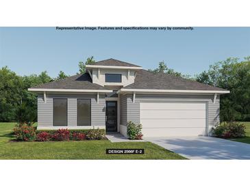 Charming single-story home with modern design, featuring a two-car garage and beautifully landscaped front yard at 318 Holly Bank Ave, Nokomis, FL 34275