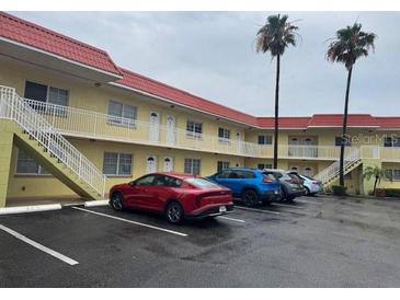 Well-maintained apartment complex with manicured landscaping, ample parking, and multiple units at 4103 Gulf Blvd # 104, St Pete Beach, FL 33706