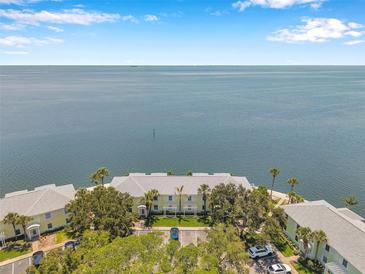 Stunning aerial view of waterfront condos with easy beach access and beautiful water views at 5260 Coquina Key Se Dr # C, St Petersburg, FL 33705