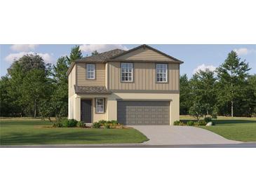 Charming two-story home features a two-car garage, well-manicured lawn, and inviting front entrance at 9467 Raised Tulip Ln, Land O Lakes, FL 34637