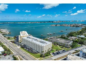 Stunning aerial view of the condominium complex with beautiful ocean and inter-coastal views and boat docks at 100 Bluff View Dr # 405A, Belleair Bluffs, FL 33770