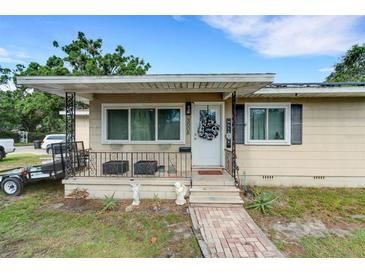 Charming single-story home with a covered front porch and well-maintained landscaping, creating a welcoming curb appeal at 3008 Jackson N St, St Petersburg, FL 33704