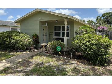 Charming single-story home with lush landscaping, walkway and cozy front porch at 3827 15Th N Ave, St Petersburg, FL 33713