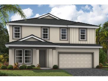 Charming two-story home with a two car garage, manicured lawn and beautifully landscaped front yard at 3927 Farm Garden Ct, Lakewood Ranch, FL 34211