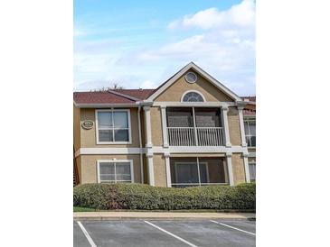 Inviting condo showcasing a charming balcony with a beige exterior paint scheme at 9481 Highland Oak Dr # 814, Tampa, FL 33647