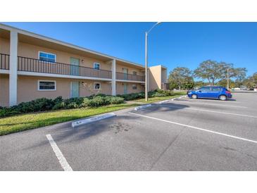 Exterior view of the two-story building with parking, reserved space available at 12300 Park Blvd # 222, Seminole, FL 33772