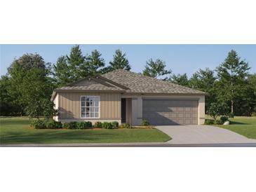 Charming one-story home featuring a neutral color palette, manicured lawn, and attached two-car garage at 12949 Shining Blue Nile Ln, Parrish, FL 34219