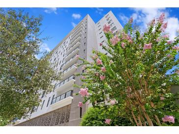 Beautiful, modern high-rise condo building with balconies and vibrant landscaping at 199 Dali Blvd # 2, St Petersburg, FL 33701