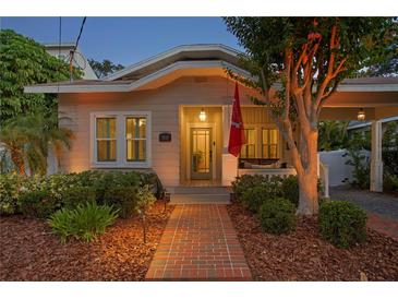 Charming home with a brick walkway, inviting porch, and manicured landscaping at 3620 W San Pedro St, Tampa, FL 33629