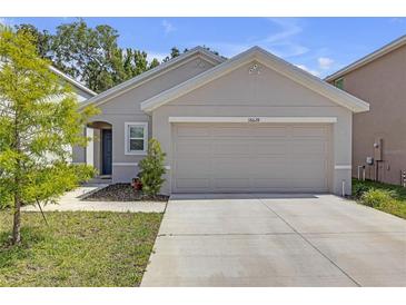 Charming one-story home with a neutral paint scheme and a two-car garage at 36628 Spanish Rose Dr, Dade City, FL 33525