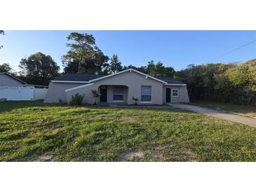 Charming single-story home featuring a well-maintained lawn and a classic architectural design at 11259 Elgin Blvd, Spring Hill, FL 34608