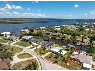 Waterfront property with lush landscaping and dock access to the beautiful canal with gulf access at 3420 Santa Clara Dr, Punta Gorda, FL 33983