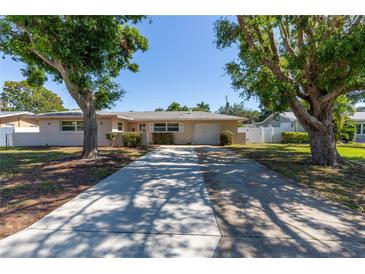 Charming single-story home with a long driveway and mature trees in a quiet neighborhood at 1400 63Rd S Ave, St Petersburg, FL 33705